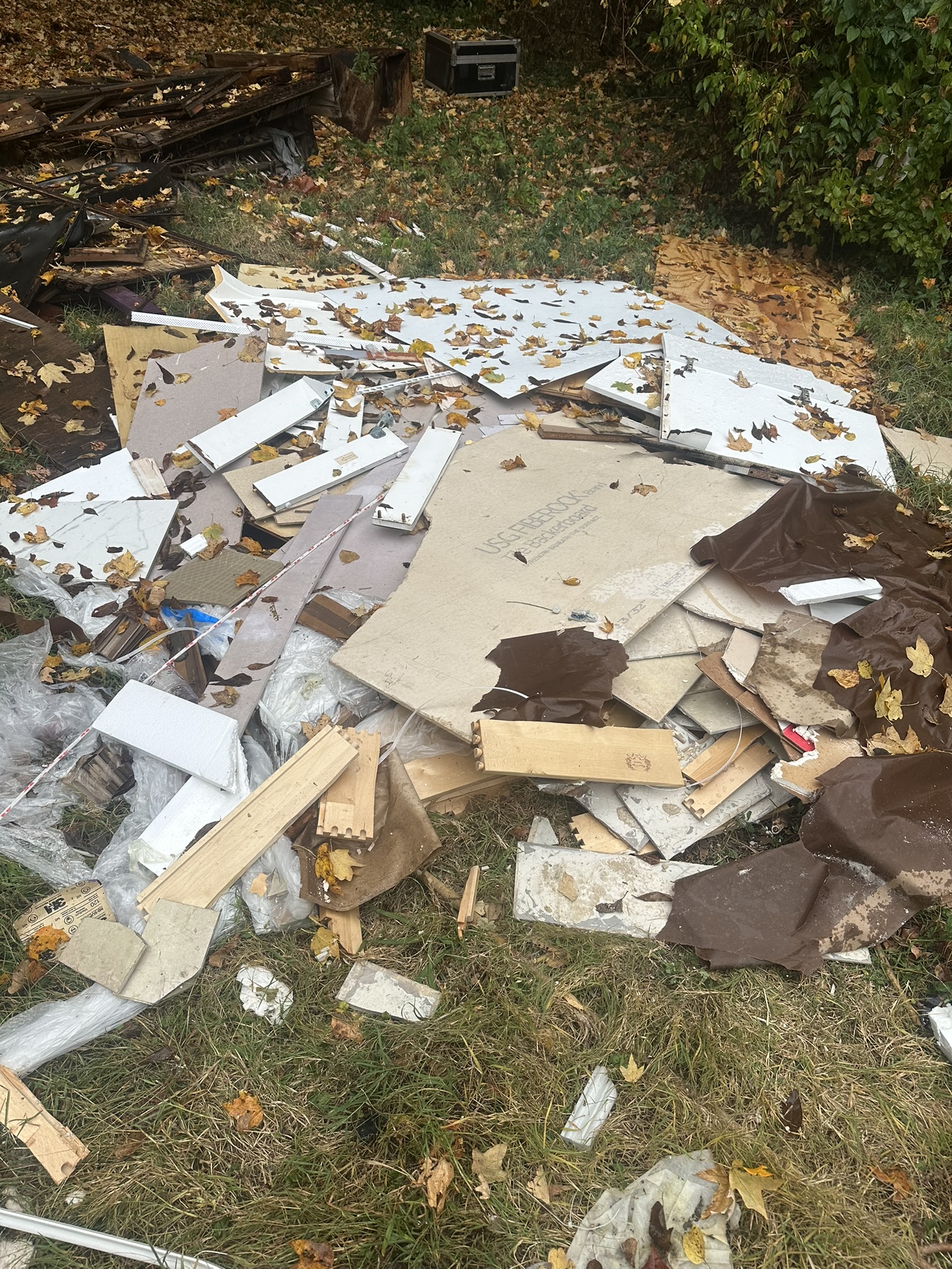 Drywall, wood and renovation debris awaiting removal